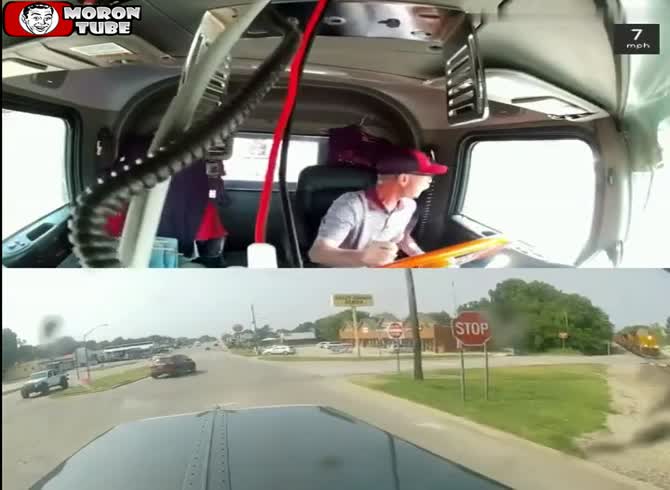 Video :A trucker is seen crossing a train track